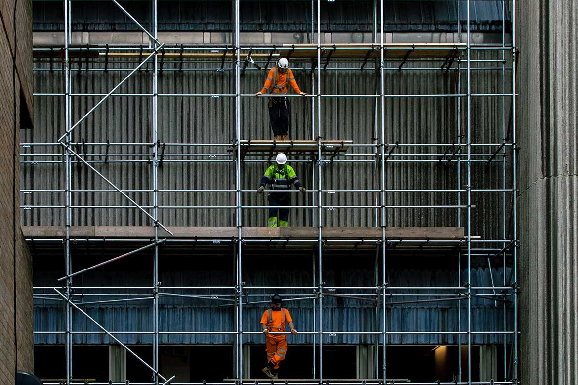 construction workers on a scaffold